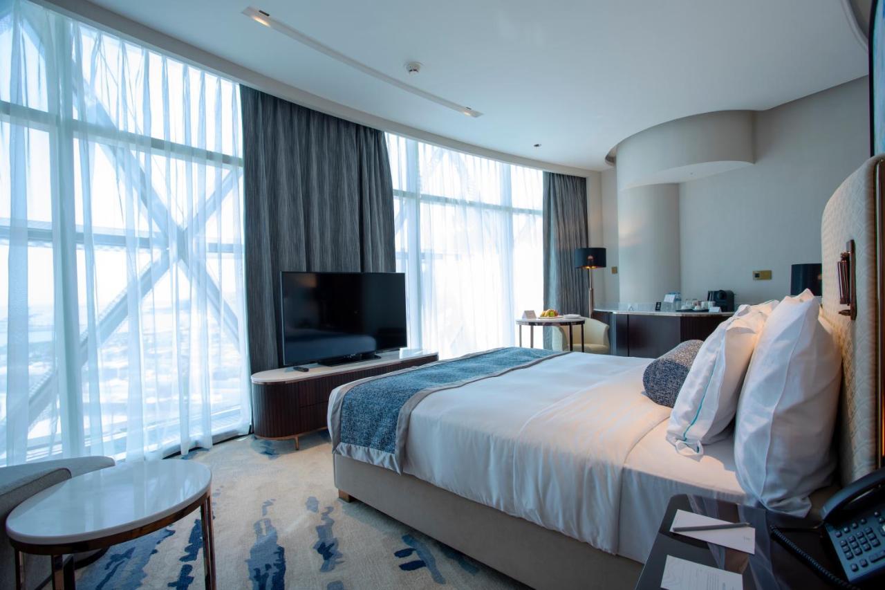 Century Marina Hotel - Lusail Bagian luar foto A bedroom at the hotel