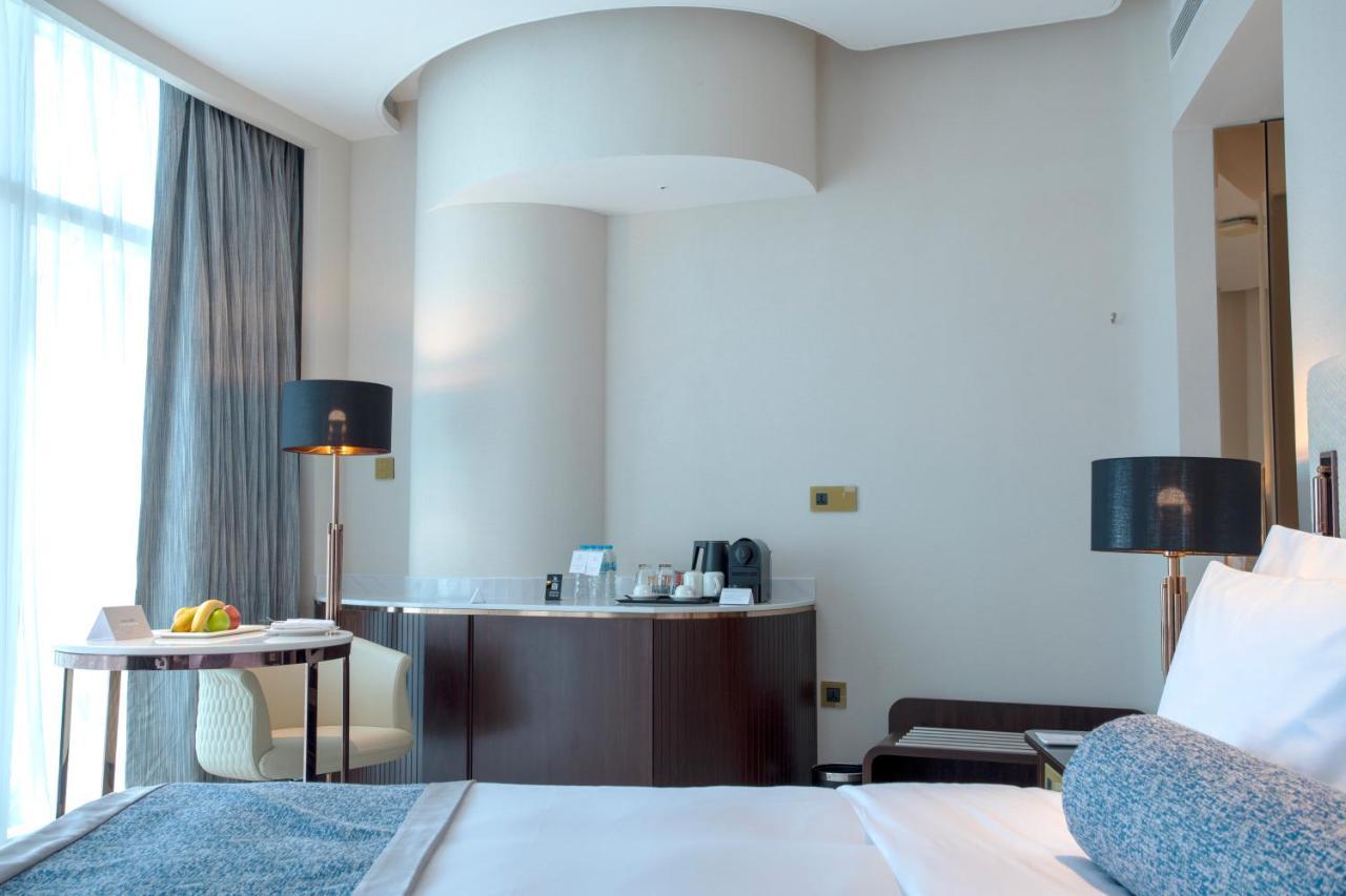 Century Marina Hotel - Lusail Bagian luar foto A room at the hotel