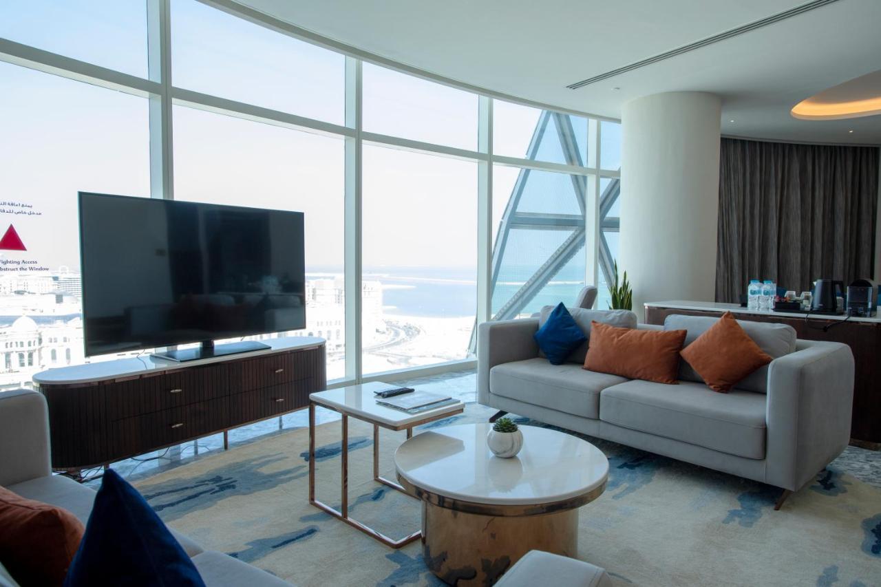 Century Marina Hotel - Lusail Bagian luar foto A living room in a suite at the hotel