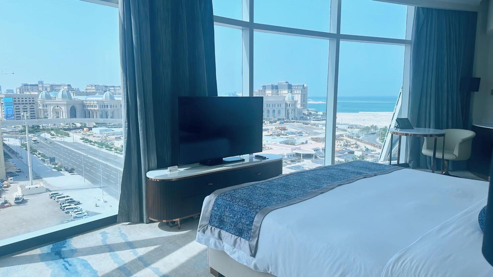 Century Marina Hotel - Lusail Bagian luar foto A bedroom at the hotel